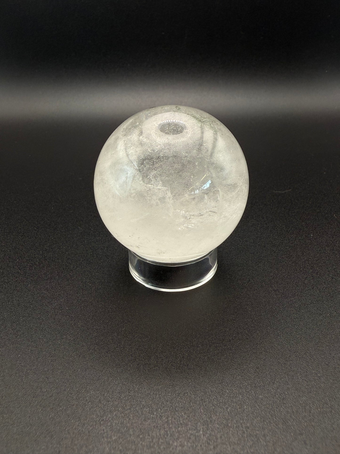 Clear quartz polished crystal sphere.