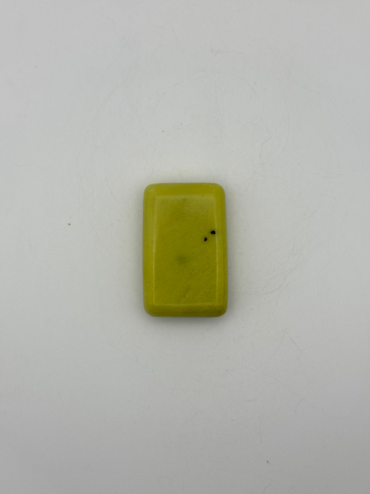 Polished healerite in the shape of a rectangular soap.