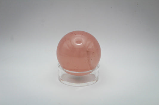 Polished rose quartz sphere.