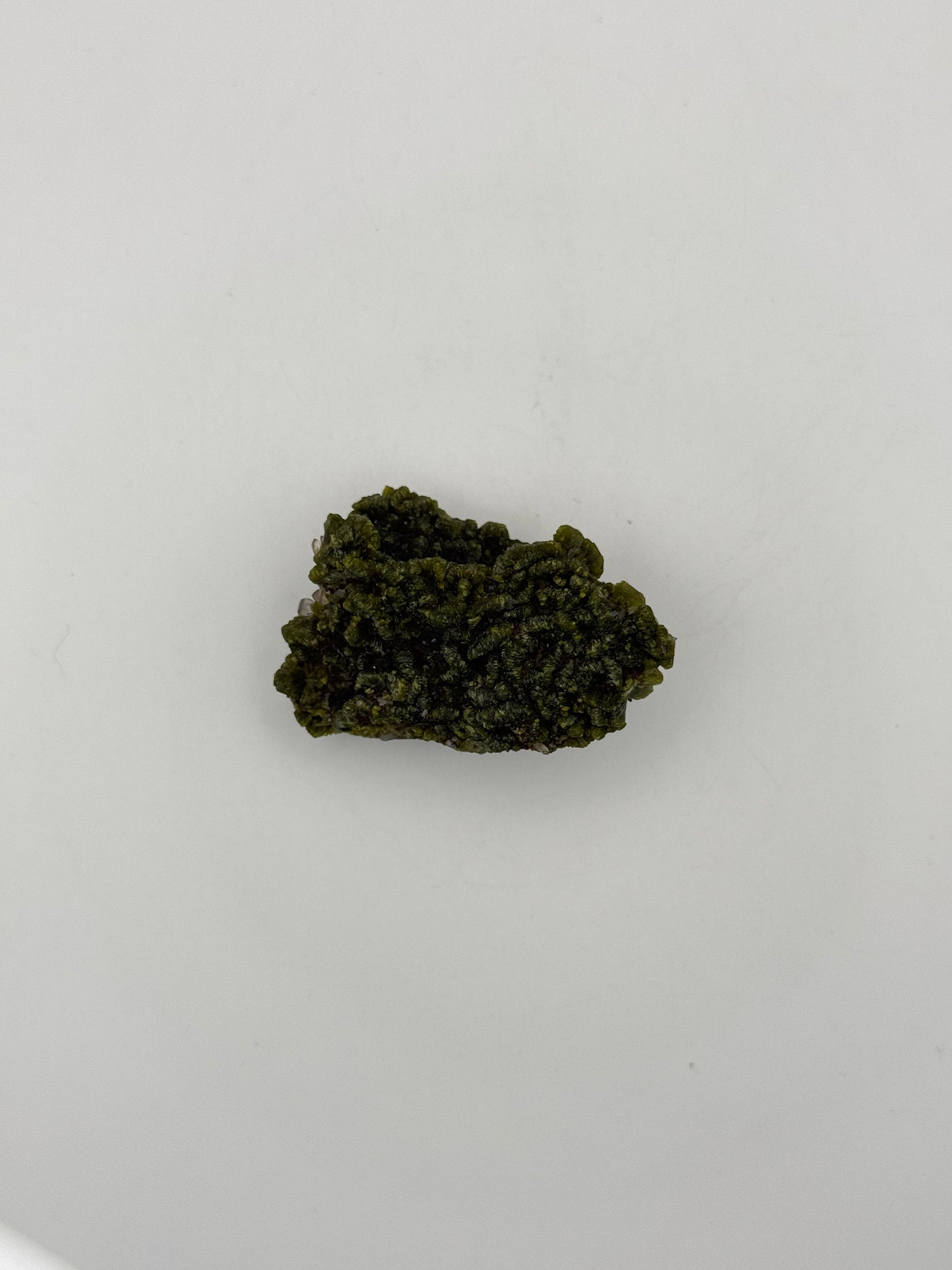 Epidote crystal cluster with good green color.