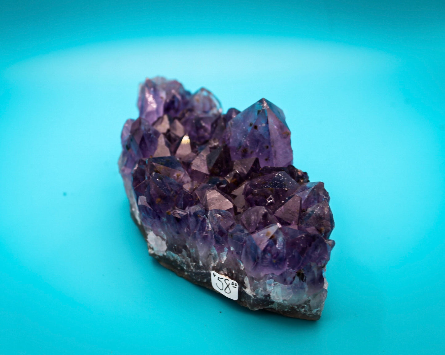 A cluster of amethyst crystals with a deep purple color.
