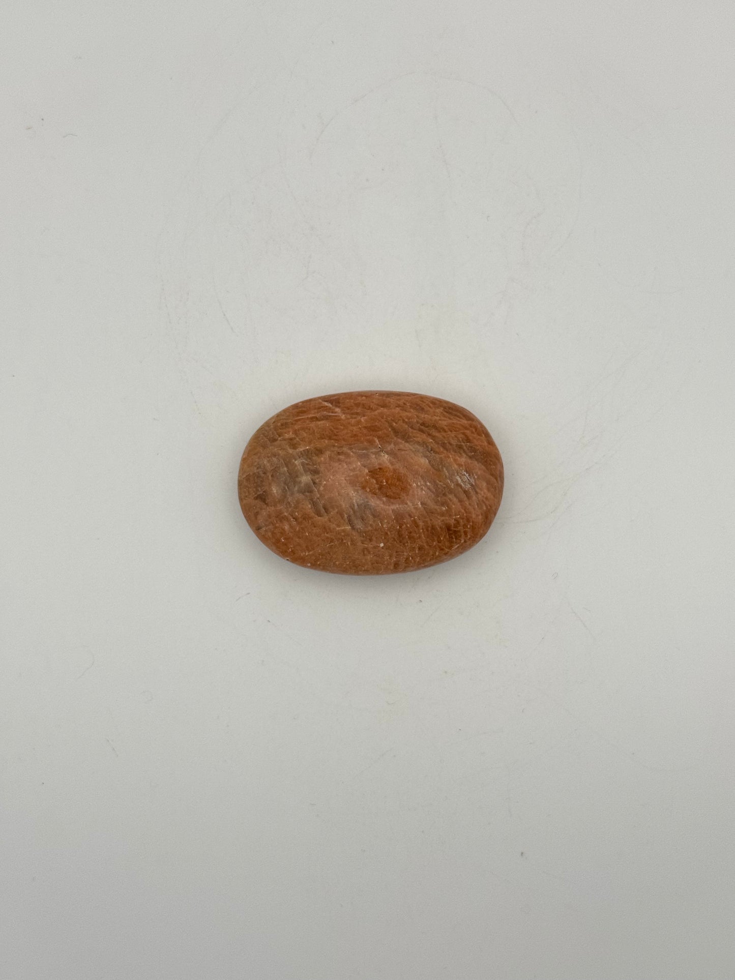 Polished Peach moonstone palm stone.