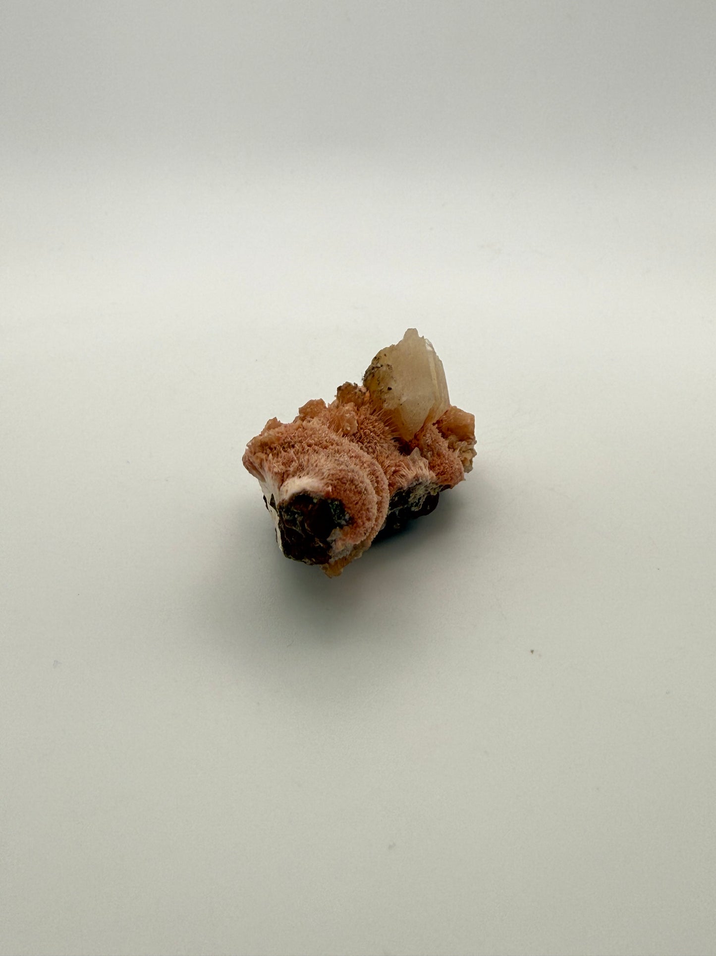 Raw Messolite crystal.