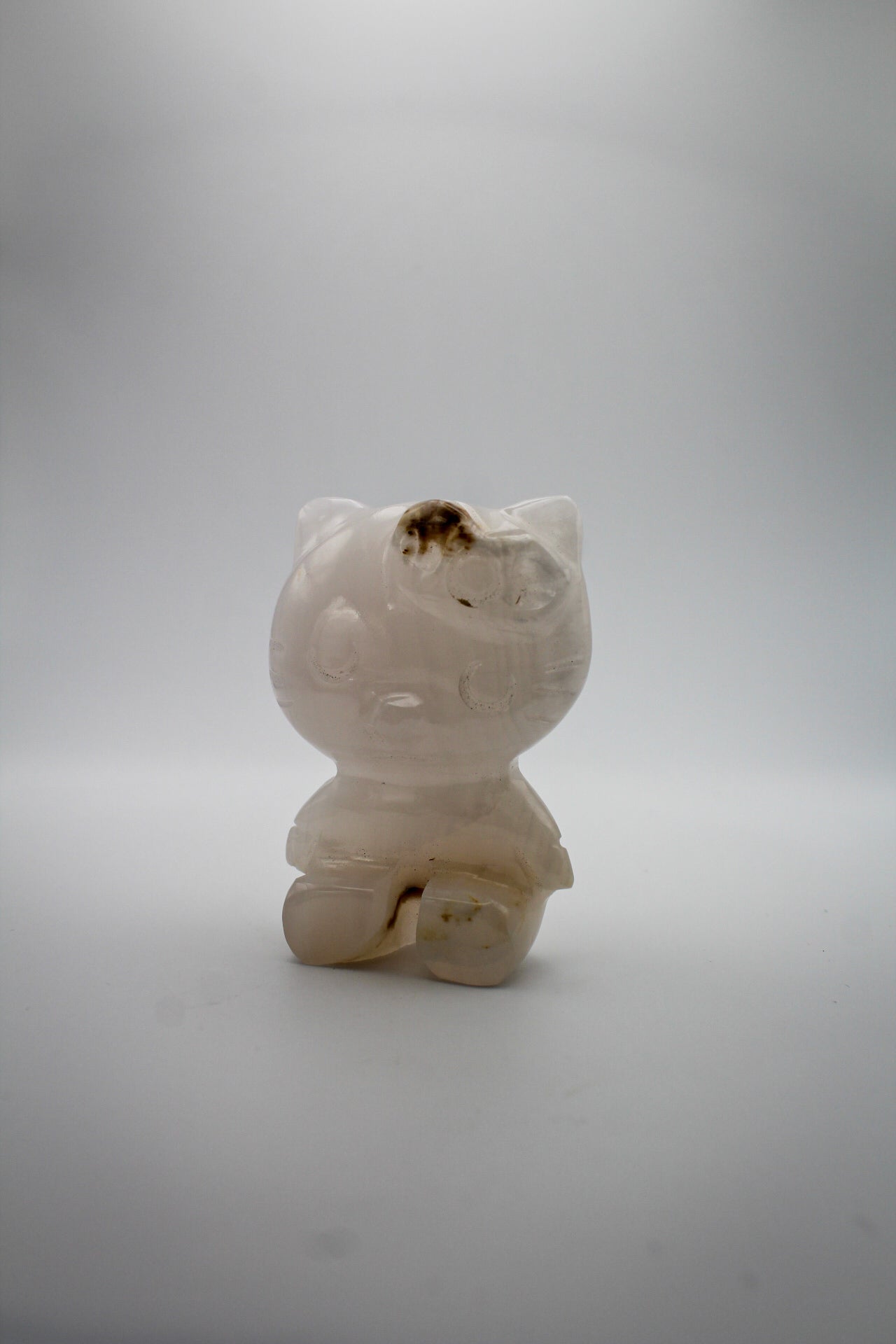 Pink Calcite crystal in the shape of Hello Kitty.