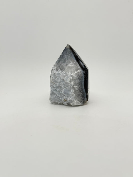 Polished druzy agate tower. About 2.25 inches tall.