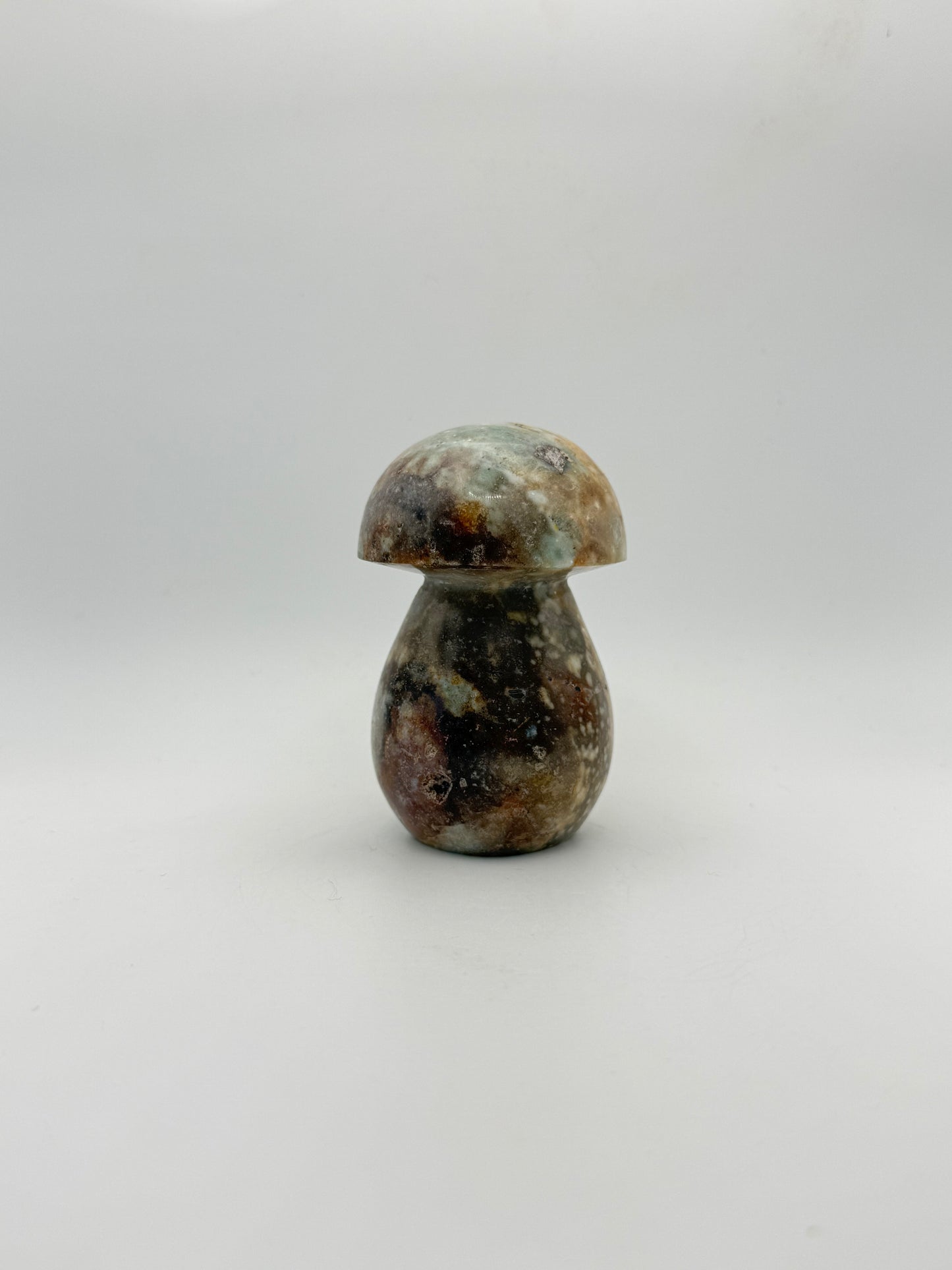 Ocean jasper stone in the shape of a mushroom.
