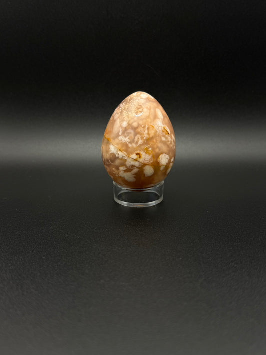 Flower Agate polished crystal in the shape of an egg.