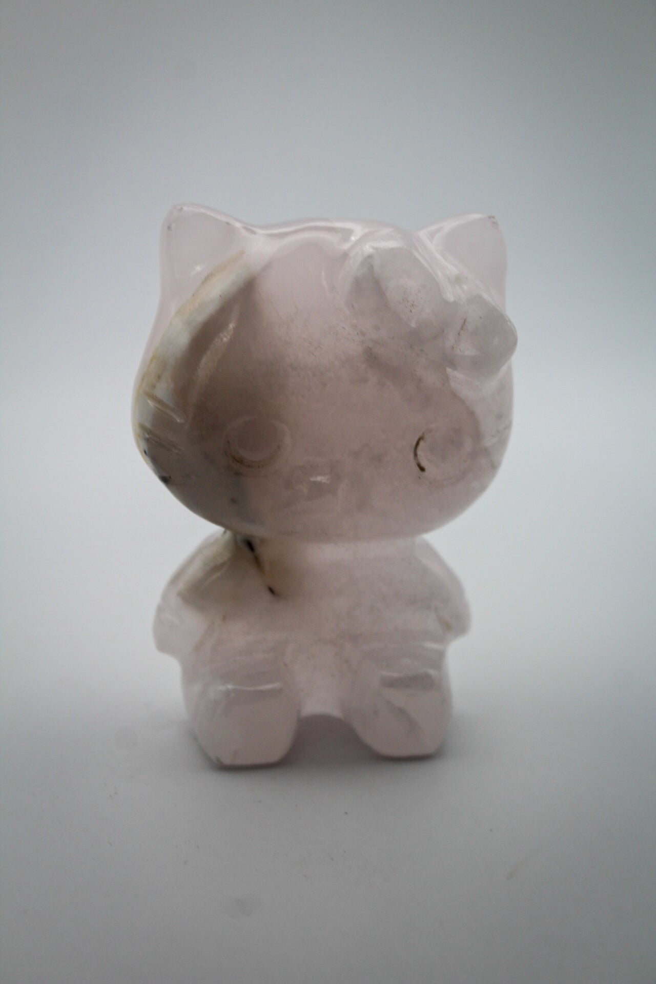 Pink Calcite crystal in the shape of Hello Kitty.
