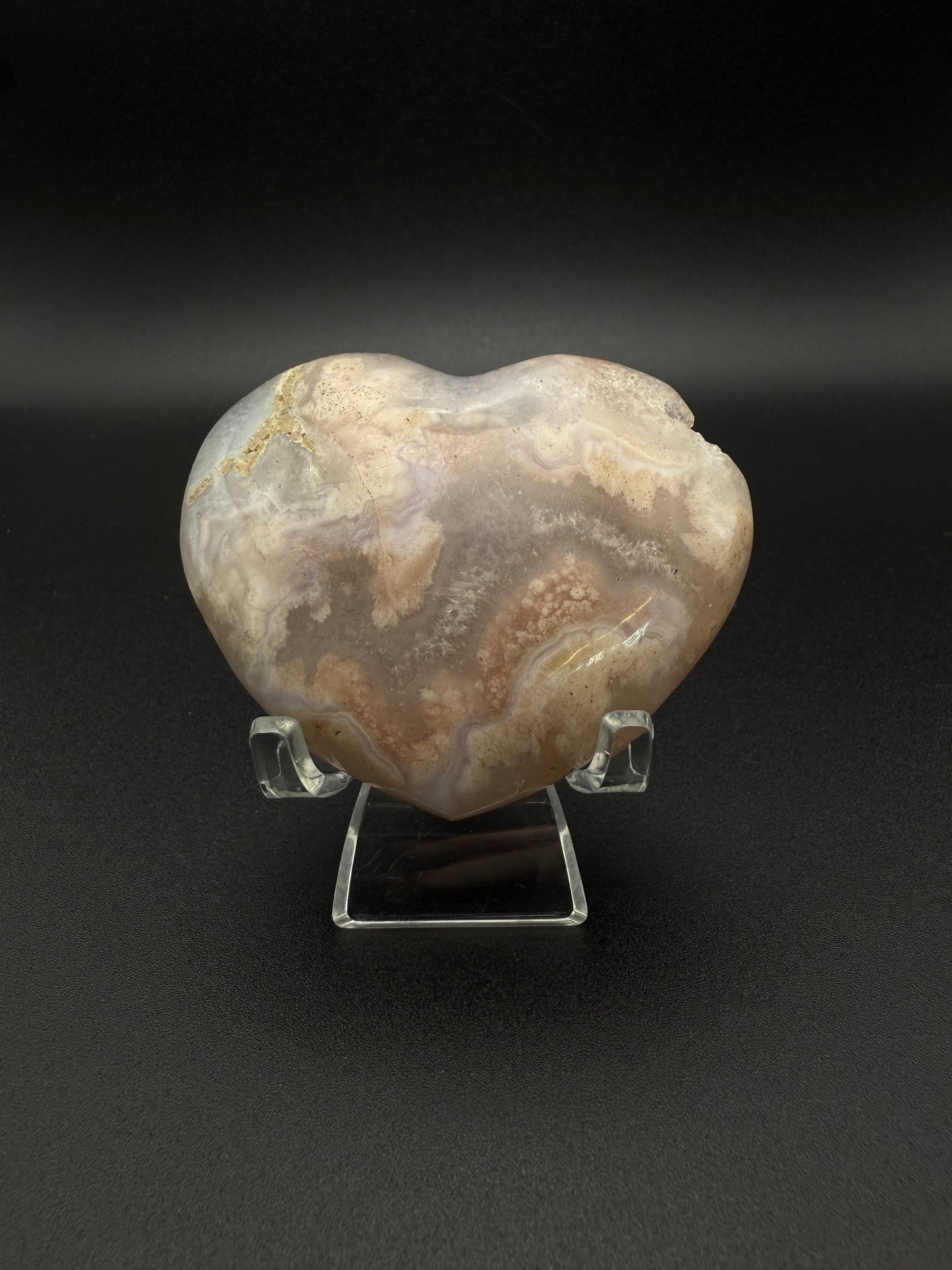 Heart-shaped polished flower agate crystal.