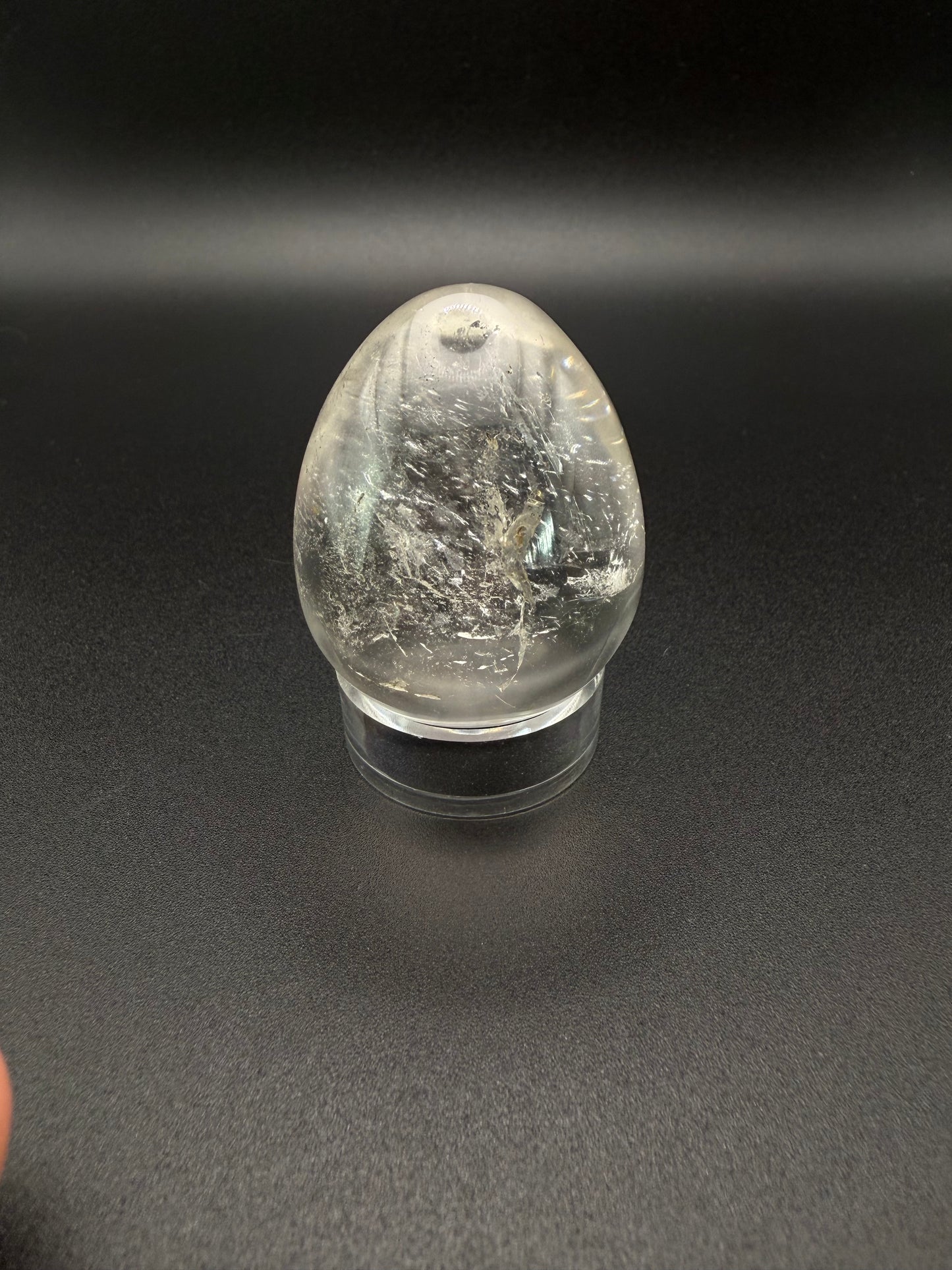 Clear quartz polished crystal in an egg shape.