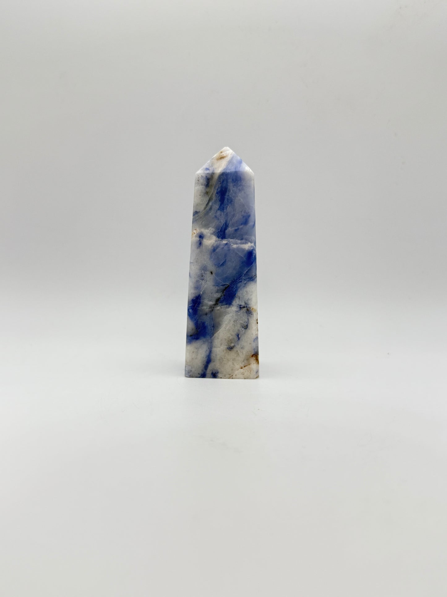 Afghanite four sided tower. Height of 3 5/8 inches, width of 1 1/8 inches.