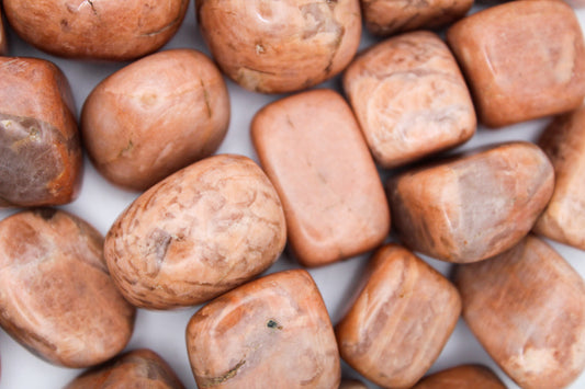 Collection of peach moonstone tumbles.