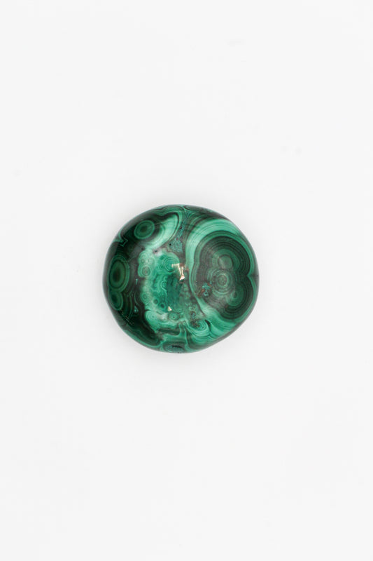 A polished malachite stone with distinctive swirling patterns, predominantly green in color.