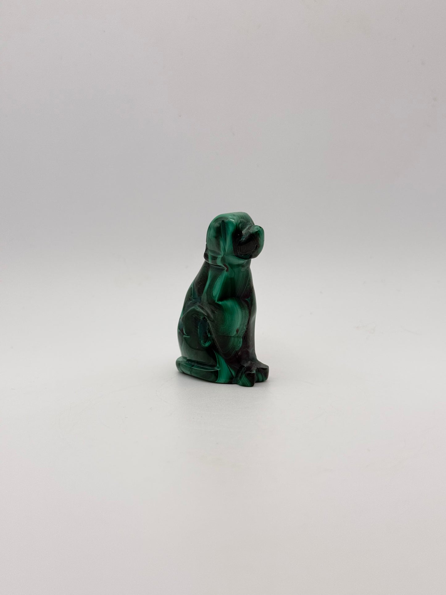Polished malachite dog carving.