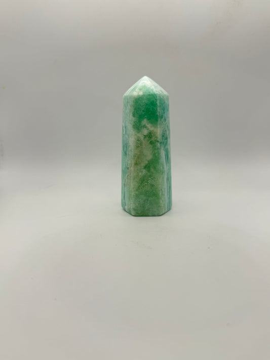Caribbean Calcite polished six sided tower. A little over 4 inches tall.