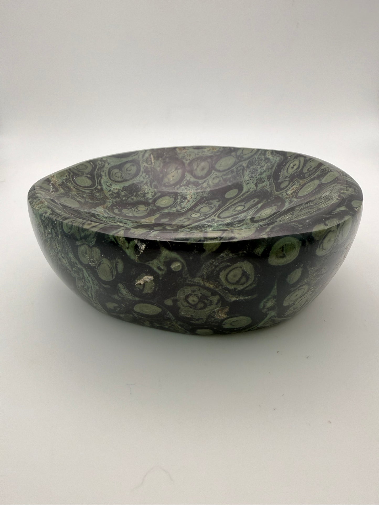 Polished kambaba jasper in the shape of a bowl.