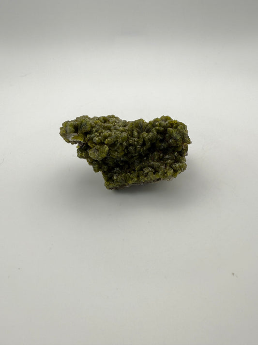 Epidote crystal cluster with good green color.
