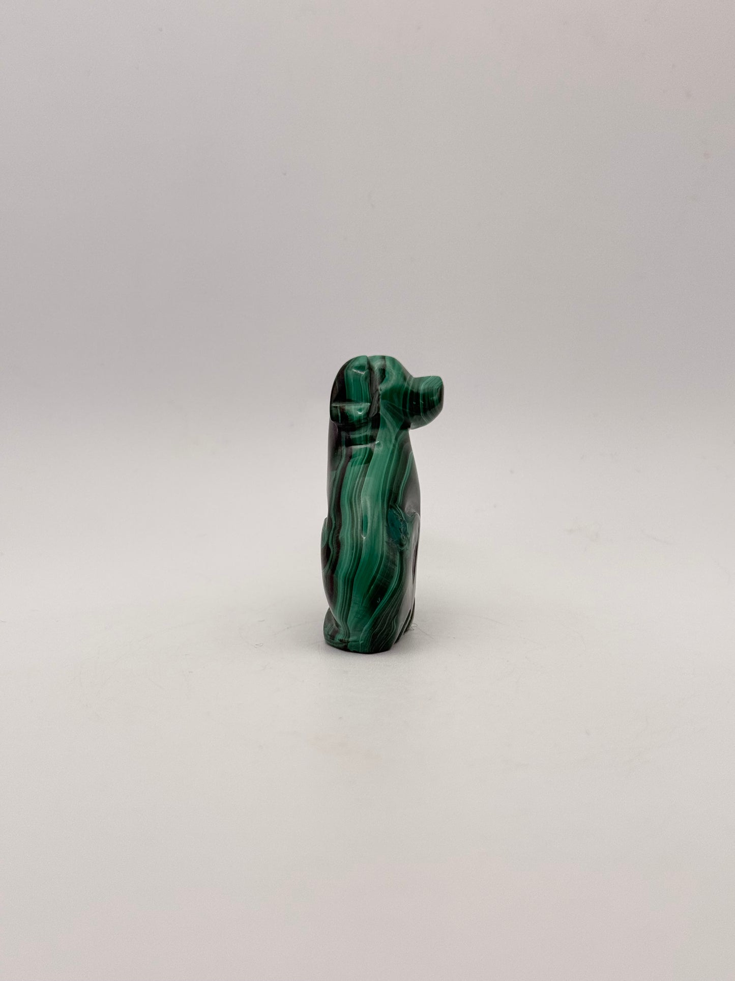 Polished malachite dog carving.
