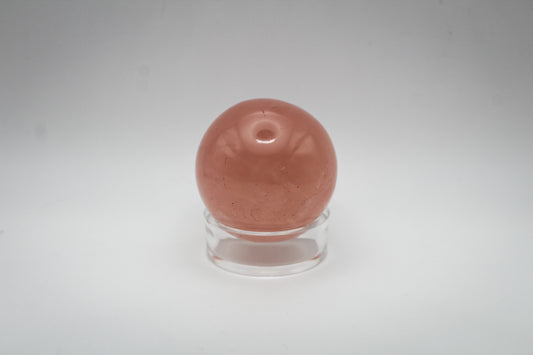 Polished rose quartz sphere.