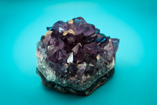 Raw piece of amethyst with amazing crystal points as well as pieces of calcite.