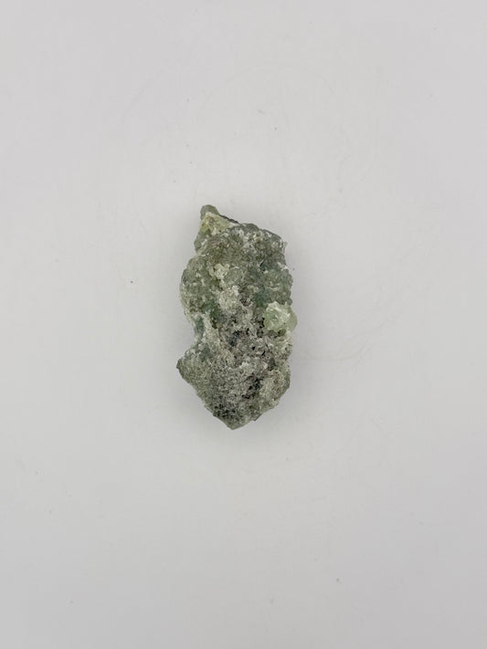 Raw Prehnite specimen with amazing green color.