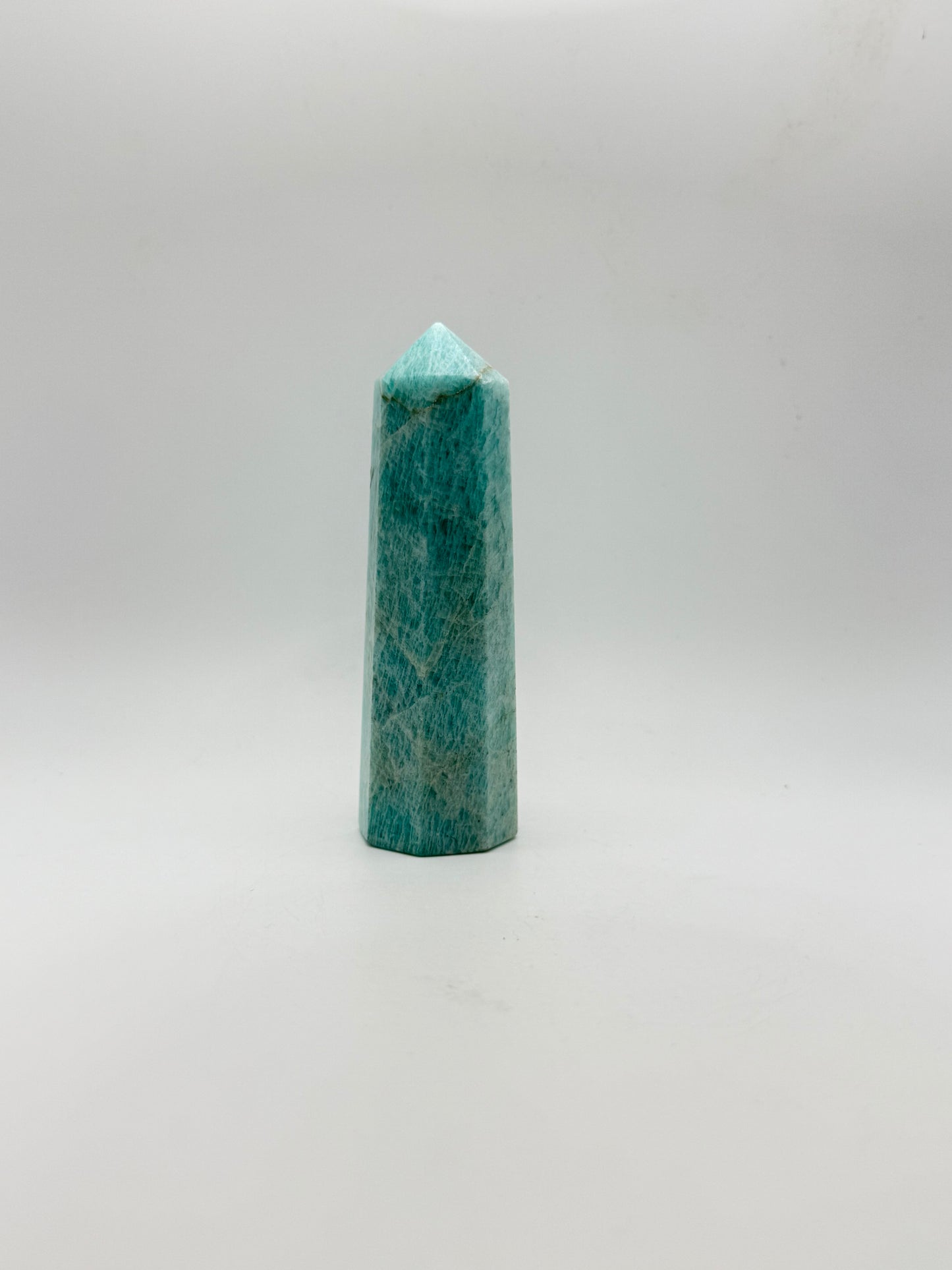 Amazonite tower with eight sides, that is about 4inches tall with a width of 1 1/4inches.