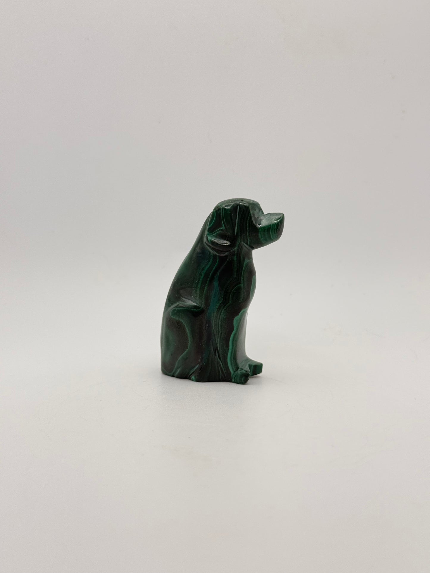 Polished malachite dog carving.
