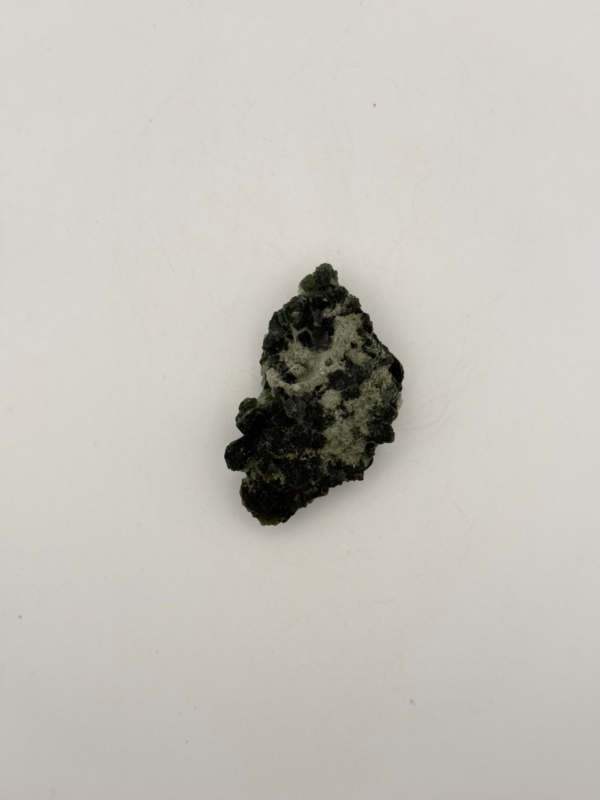 Raw prehnite specimen with amazing green color.