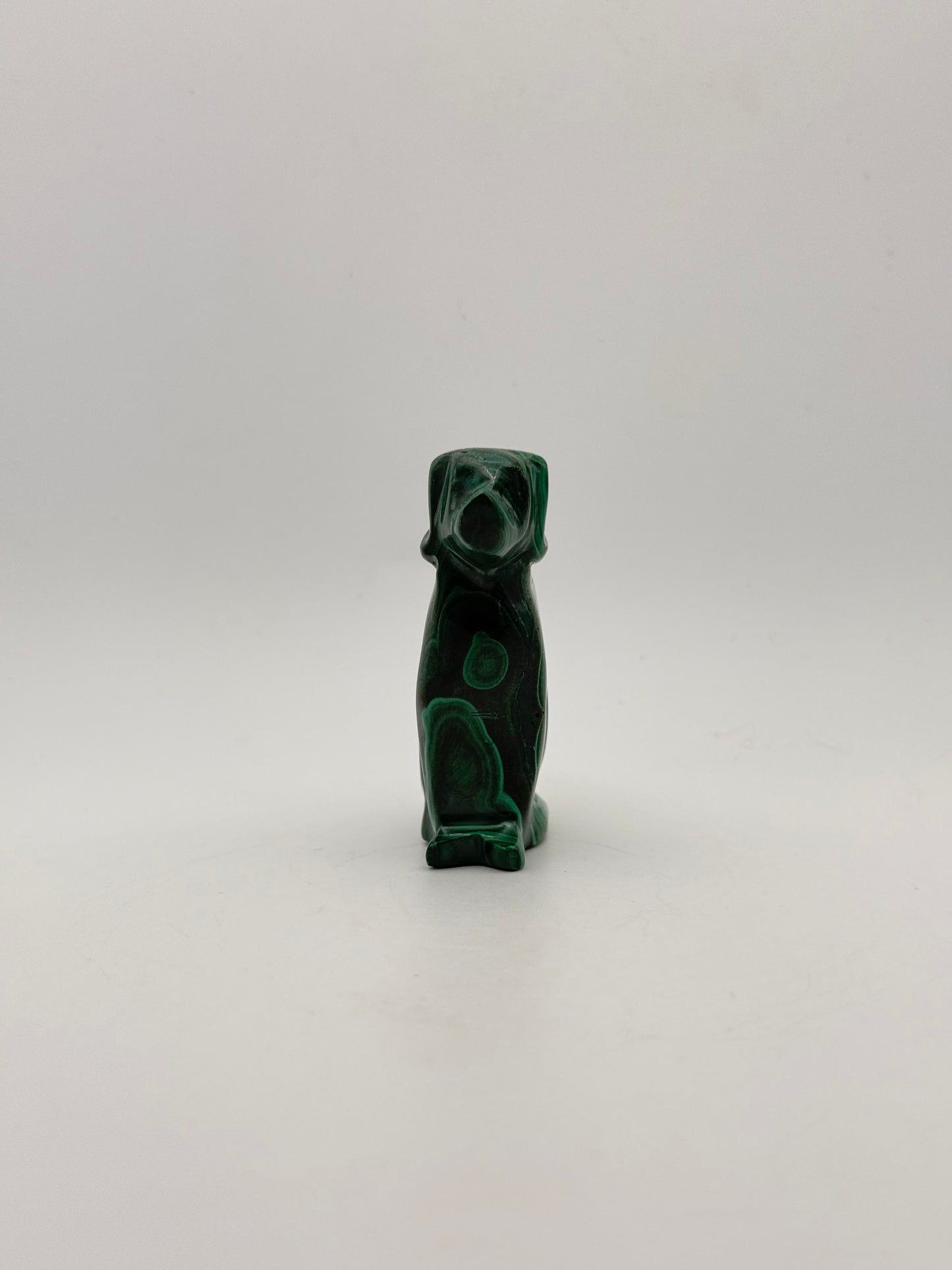 Polished malachite dog carving.