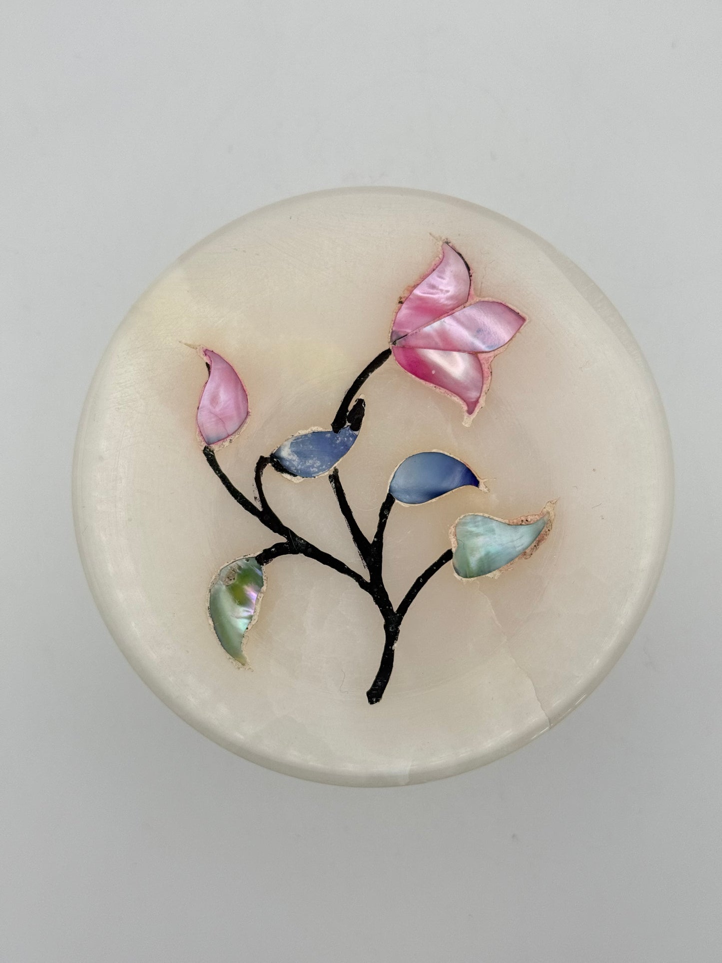 Onyx jewelry box with flowers on the lid.