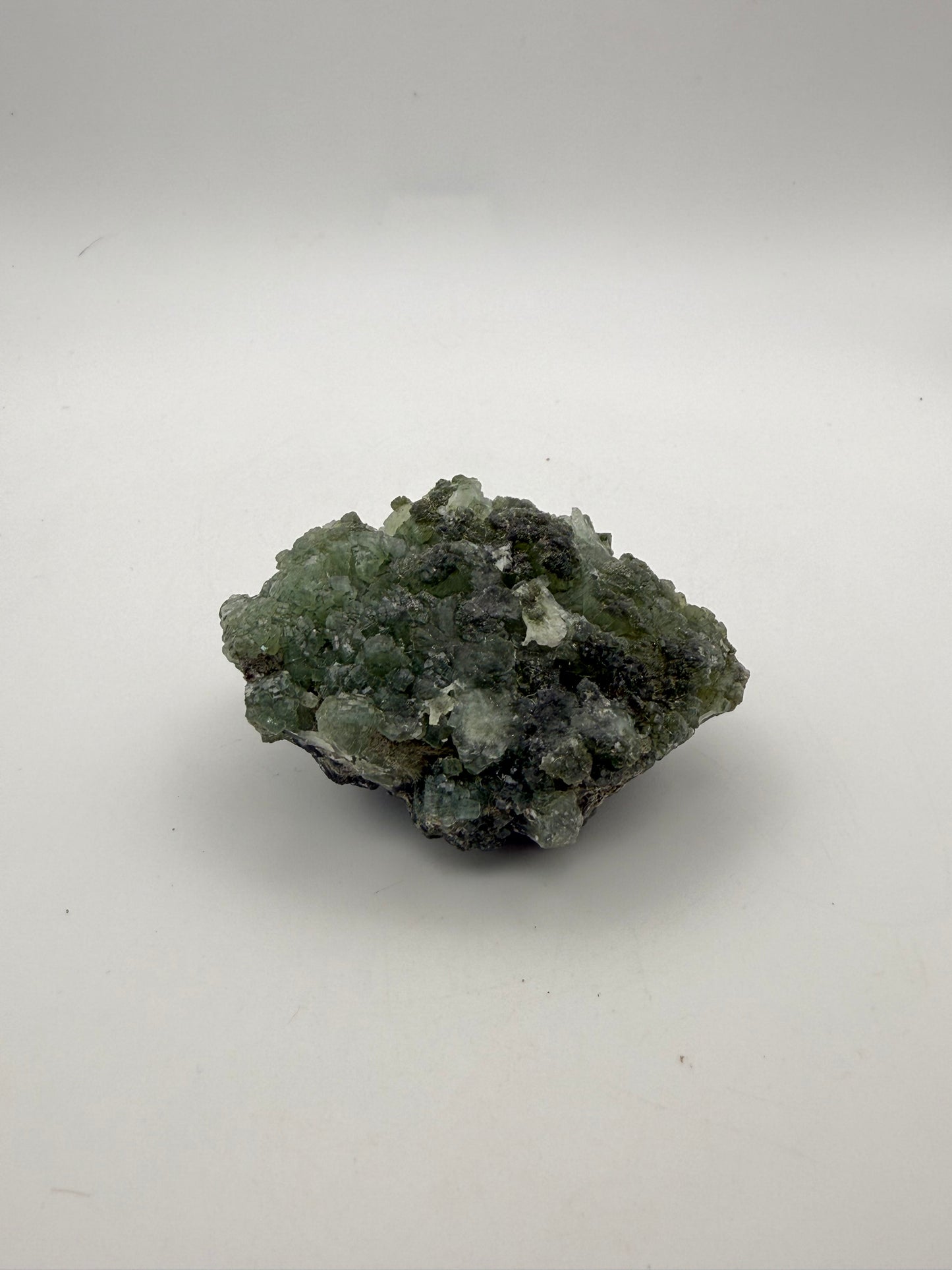 Raw Prehnite specimen with amazing green color.