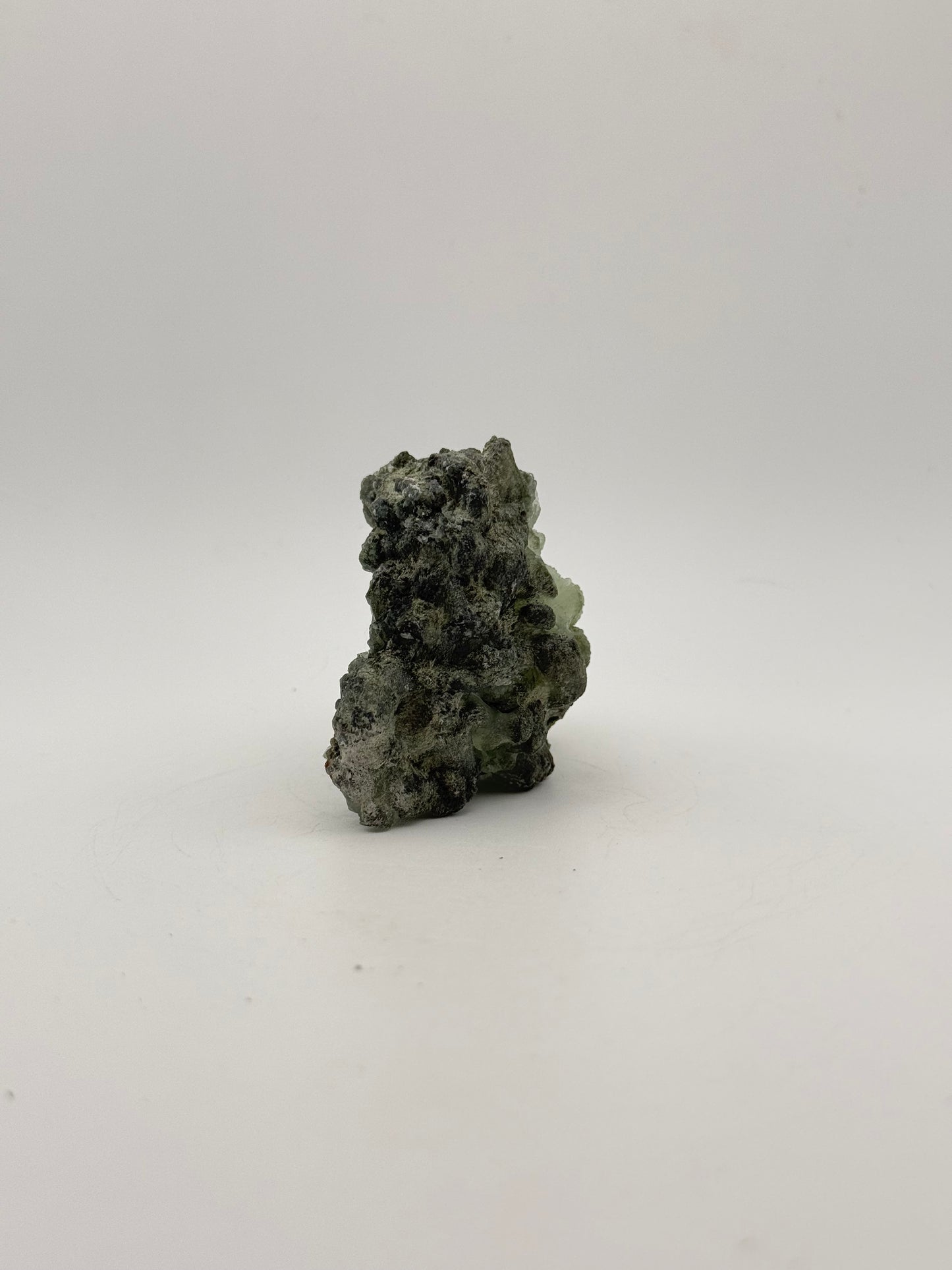 Raw Prehnite specimen with amazing green color.