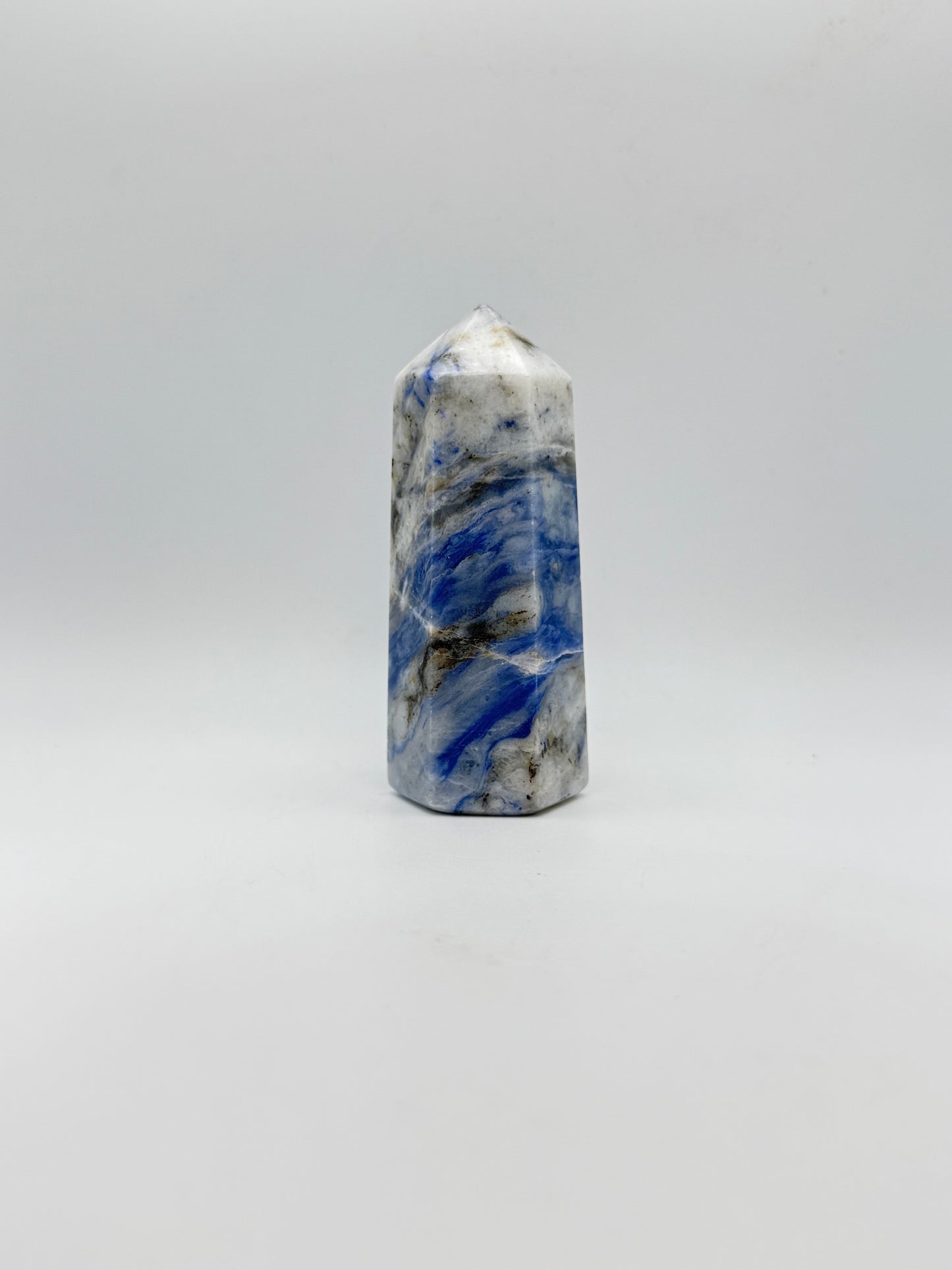 Afghanite six sided tower. Height of 3 3/4 inches, width of 1 1/2 inches.