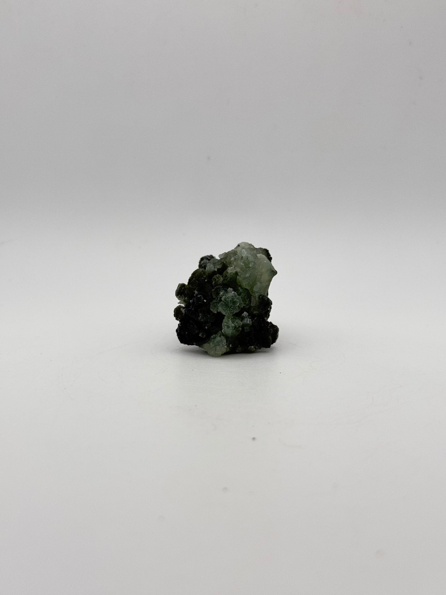 Raw Prehnite specimen with amazing green color.