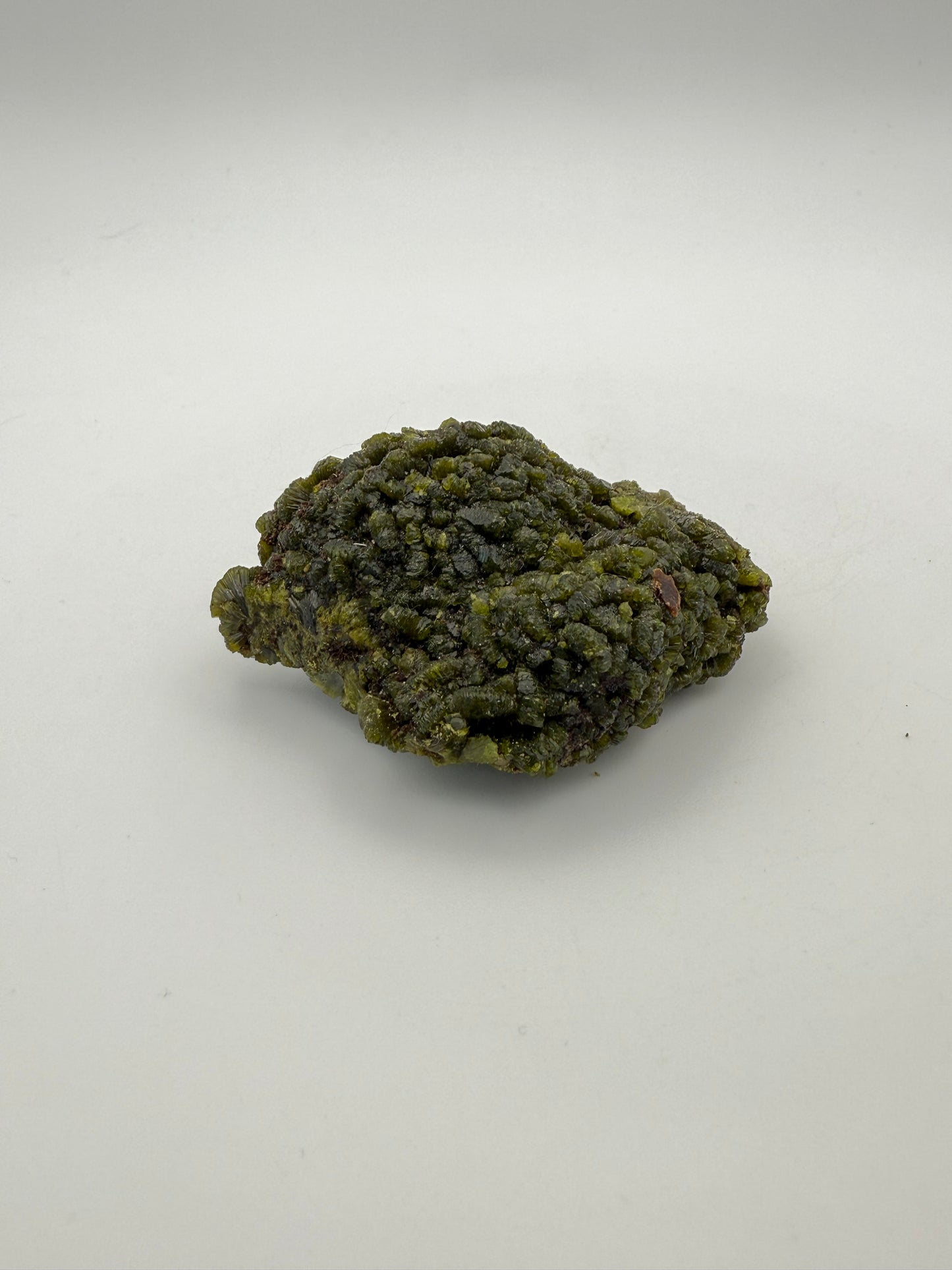 Epidote crystal cluster with good green color.