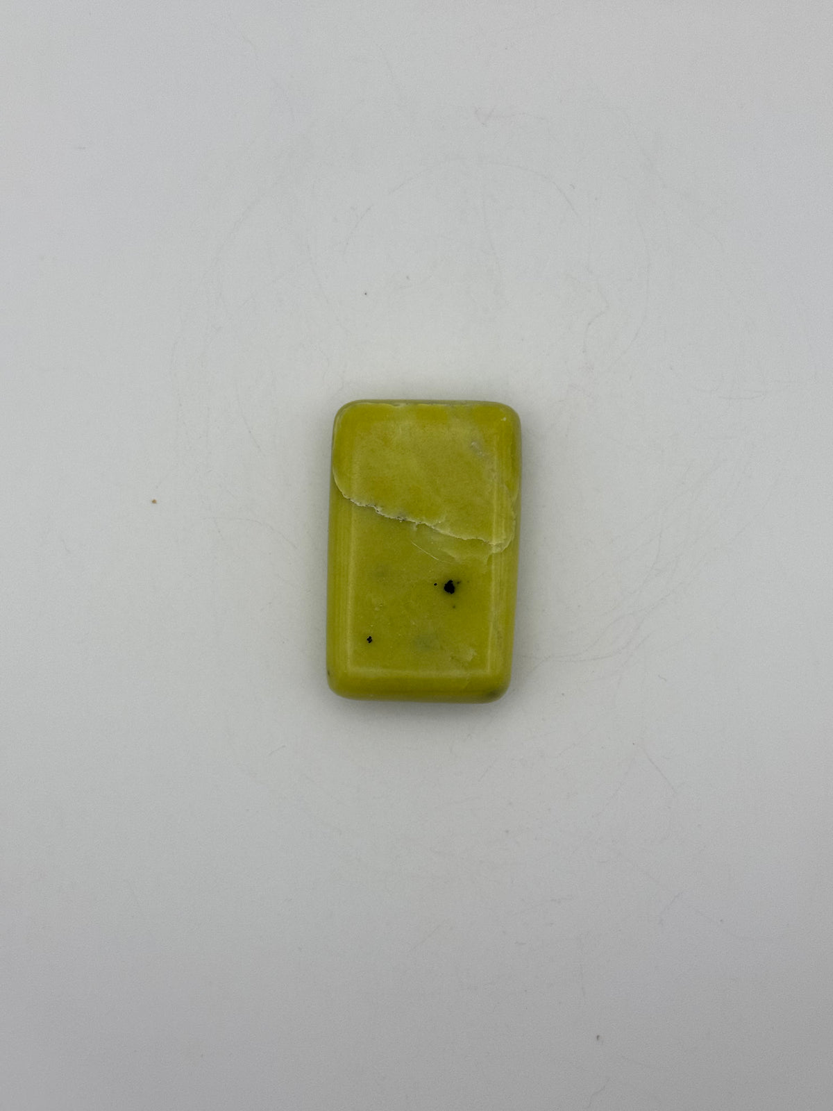 Polished healerite in the shape of a rectangular soap.