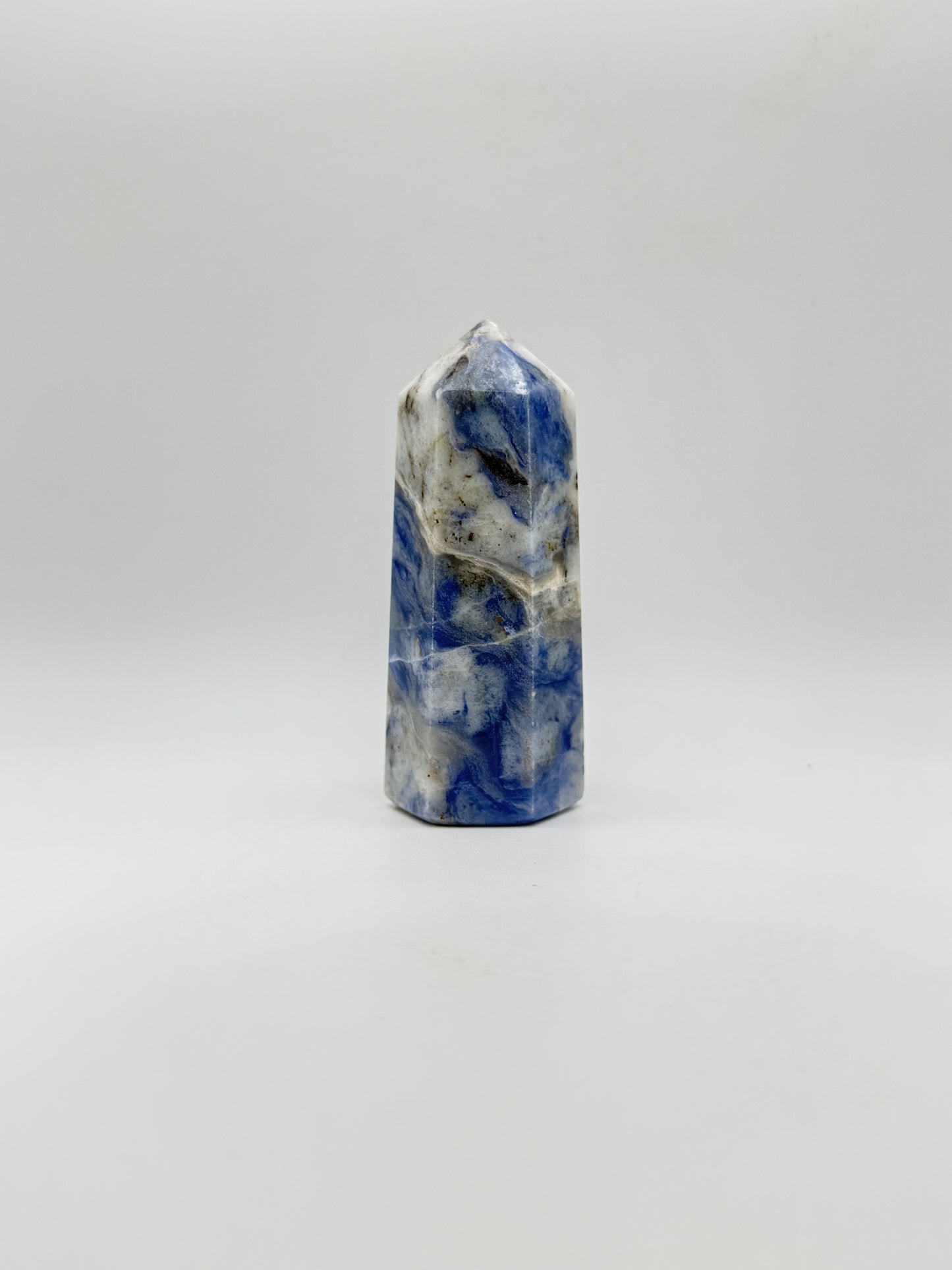 Afghanite six sided tower. Height of 3 3/4 inches, width of 1 1/2 inches.