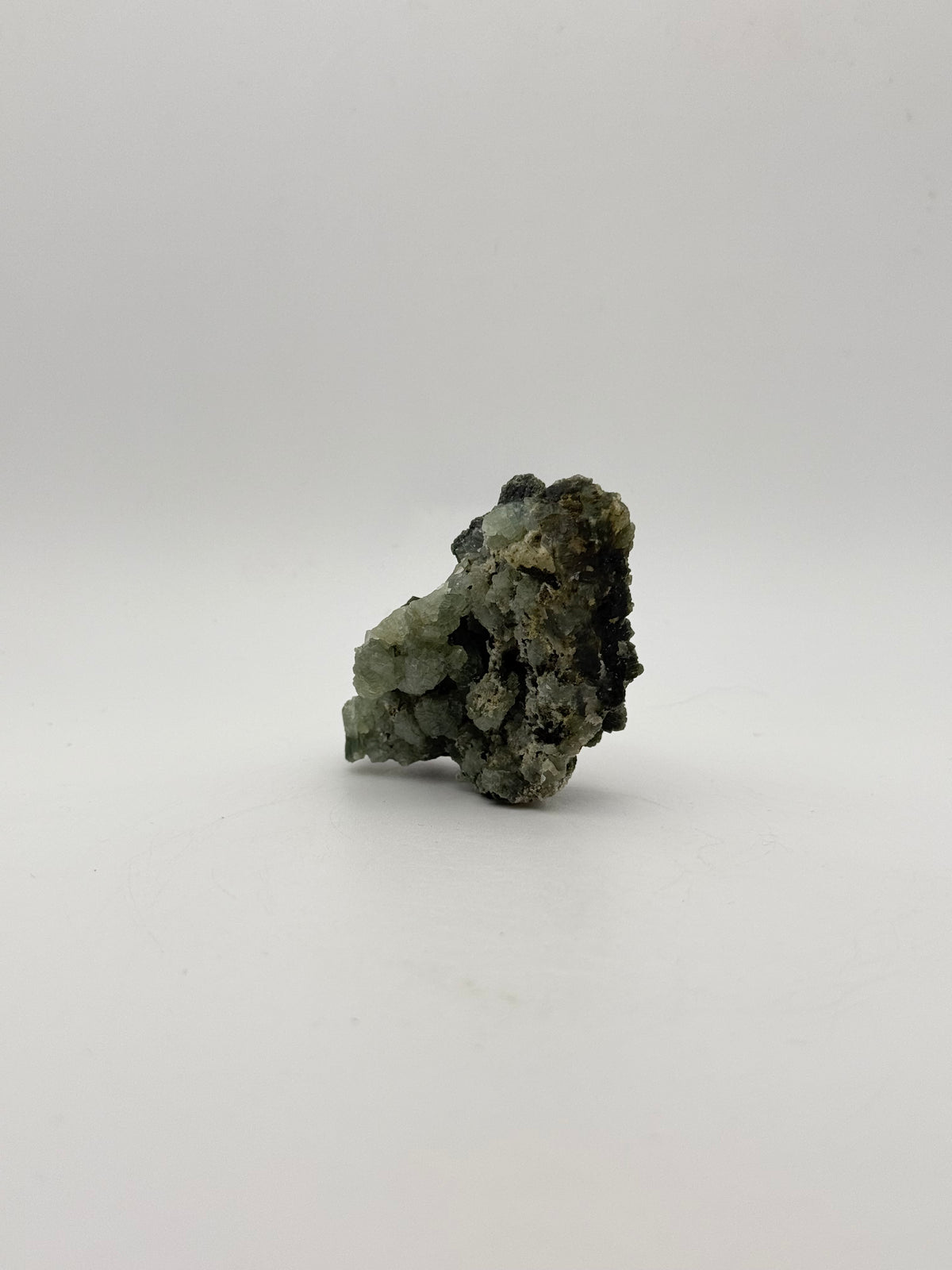 Raw prehnite specimen with amazing green color.