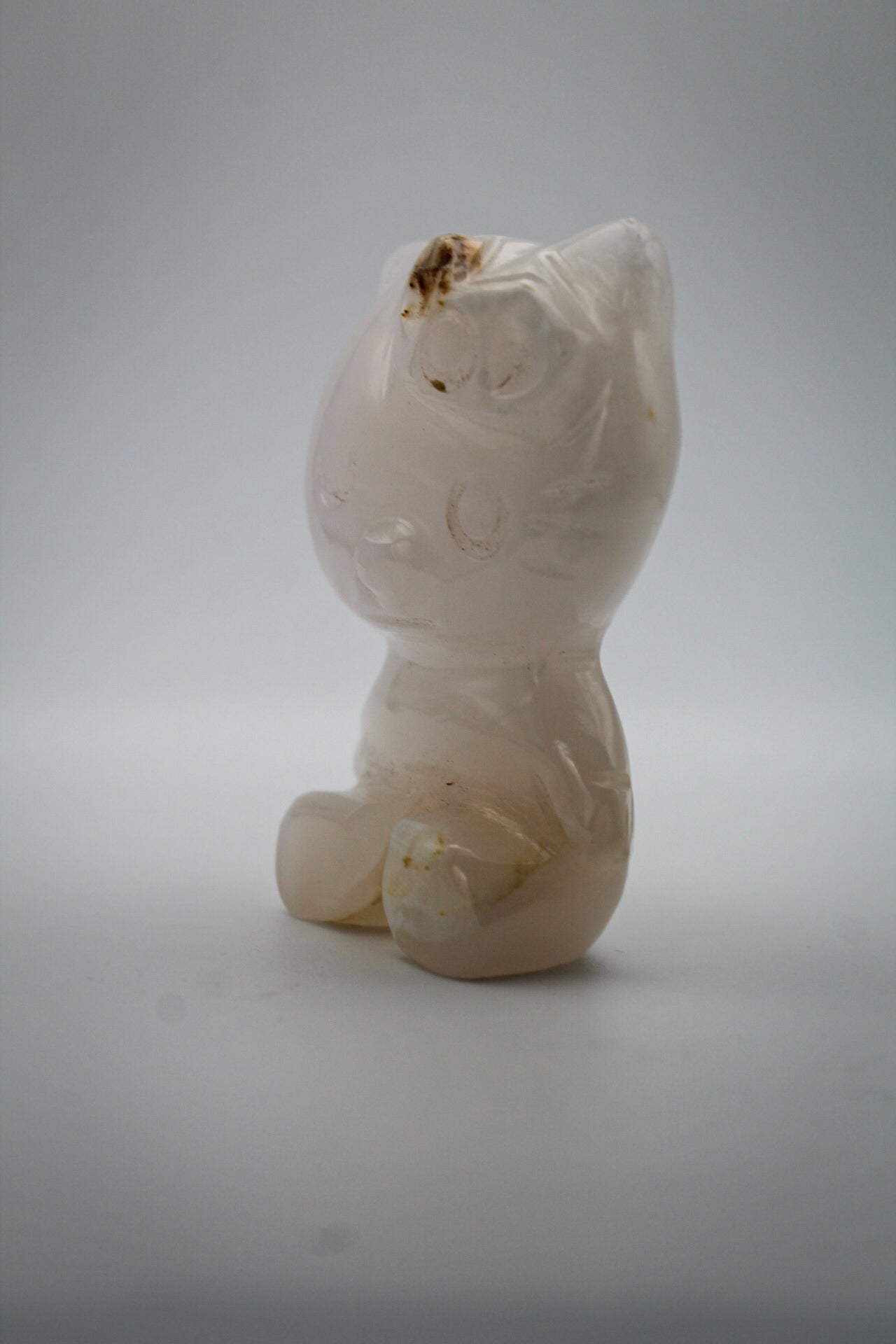 Pink Calcite crystal in the shape of Hello Kitty.