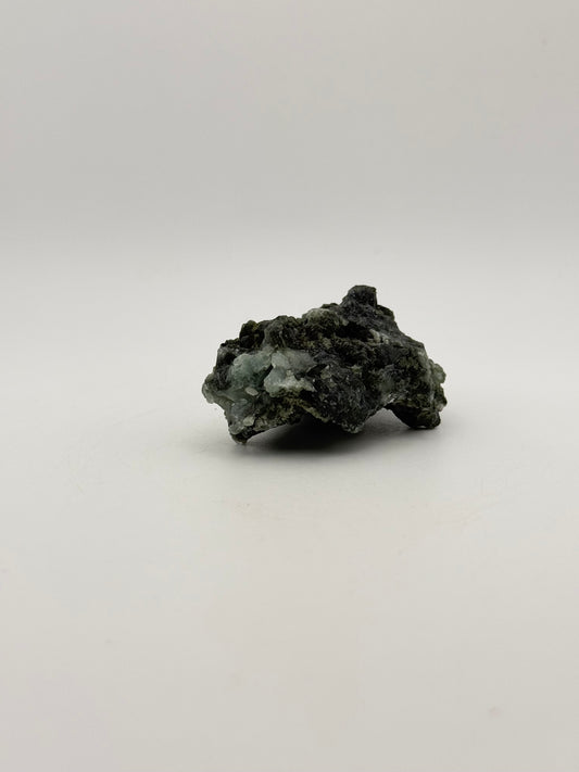 Raw Prehnite specimen with amazing green color.