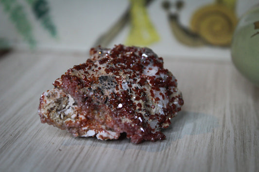 Vanadinite specimen with amazing sparkly red crystal formations.