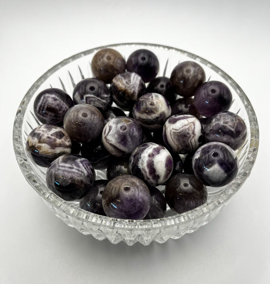 Polished amethyst in the shape of a sphere. 22mm in size