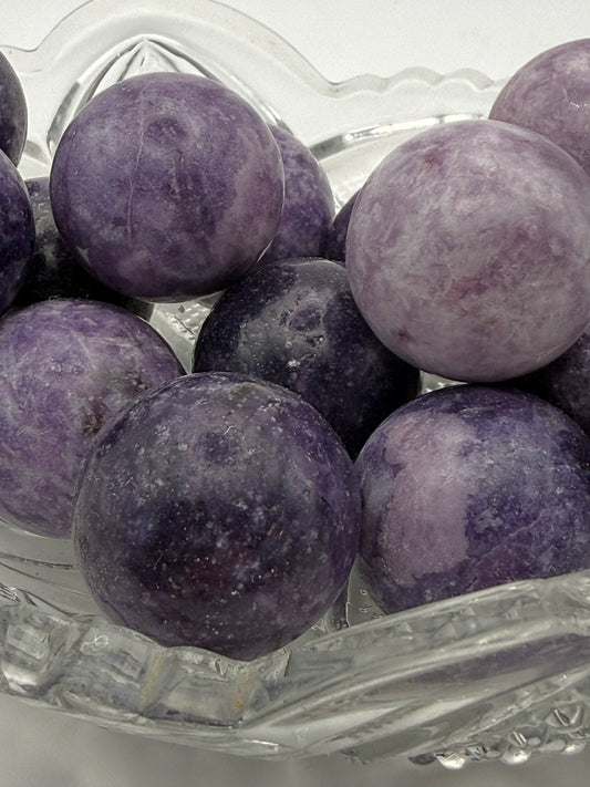 Polished Lepidolite spheres about 30mm in size.