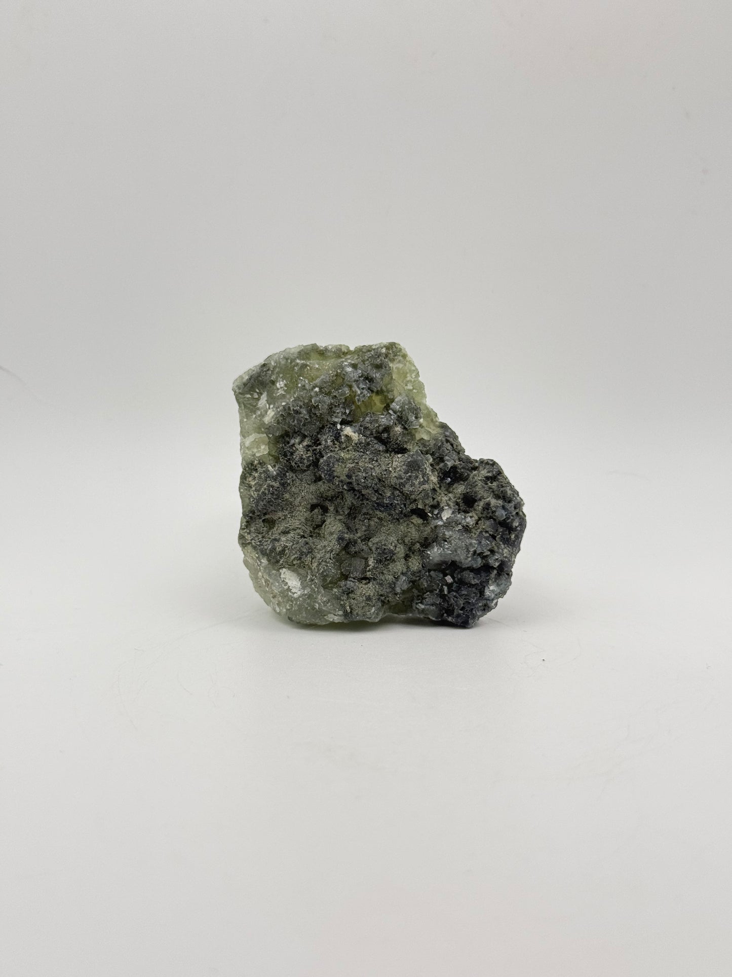 Raw Prehnite specimen with amazing green color.