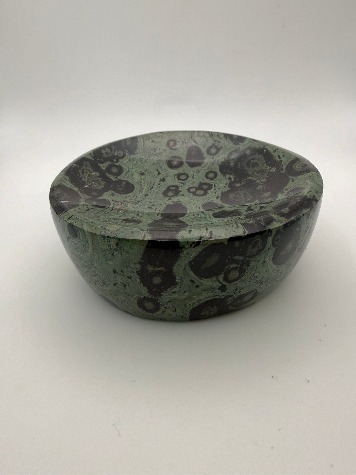Polished kambaba jasper in the shape of a bowl.