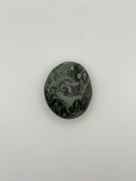 Polished kambaba jasper palm stone.