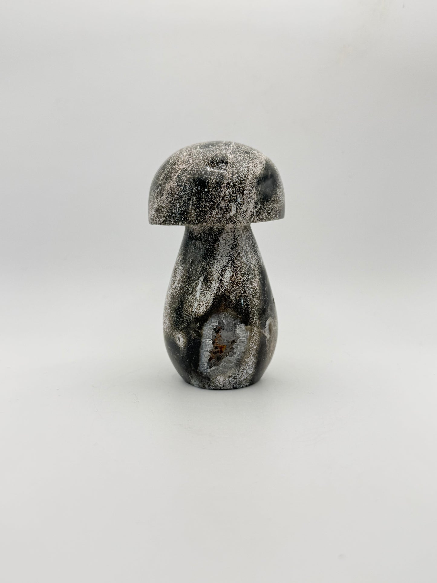 Ocean jasper stone in the shape of a mushroom.