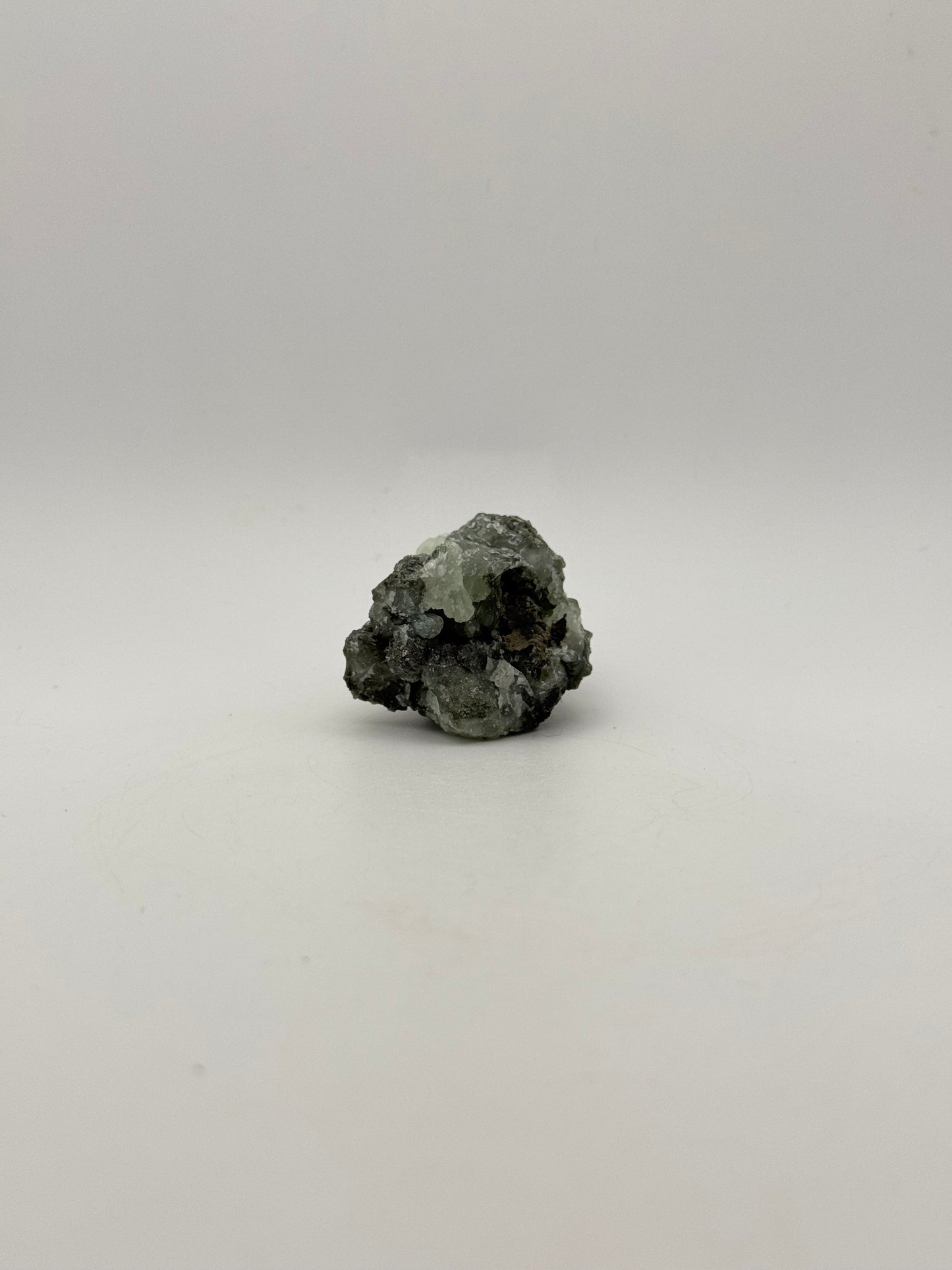 Raw prehnite specimen with amazing green color.