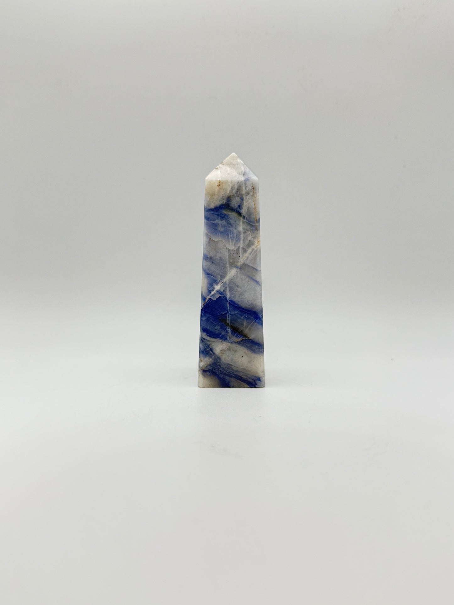 Afghanite four sided tower. Height of 3 5/8 inches, width of 1 1/8 inches.