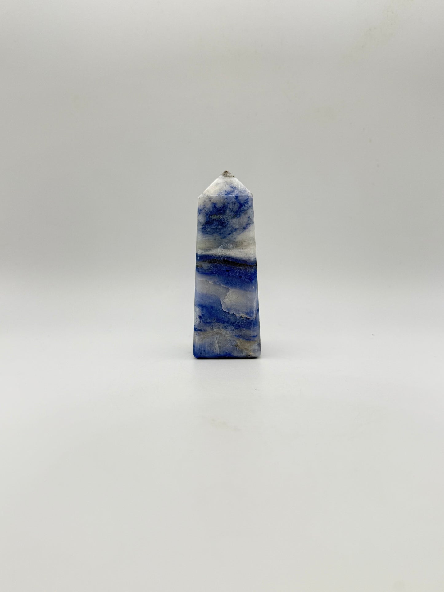 Afghanite four sided tower. Height of 3 1/4 inches, width of 1 1/4 inches.